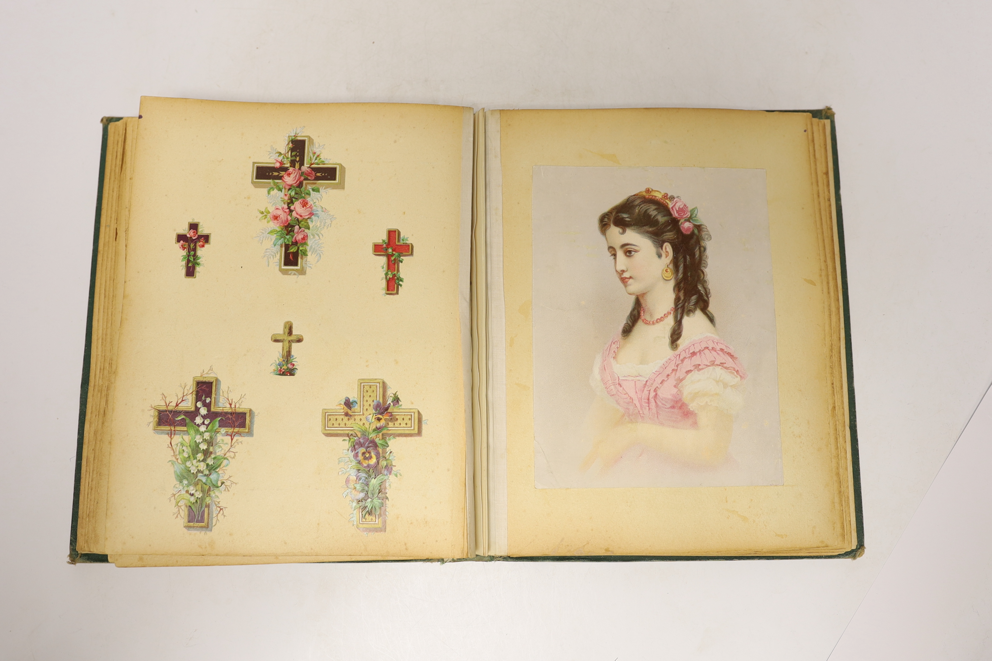 A Victorian scrap album, containing chromolithographic cards and scraps and pressed leaves and two other items